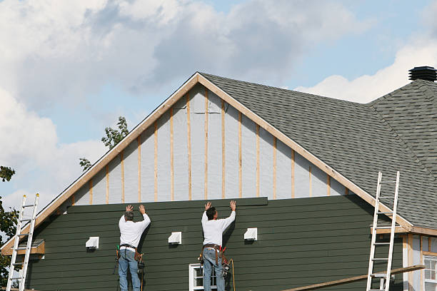 Professional Siding technician working in Ridge, MD